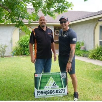 Happy Homeowners Celebrating Their New Roof